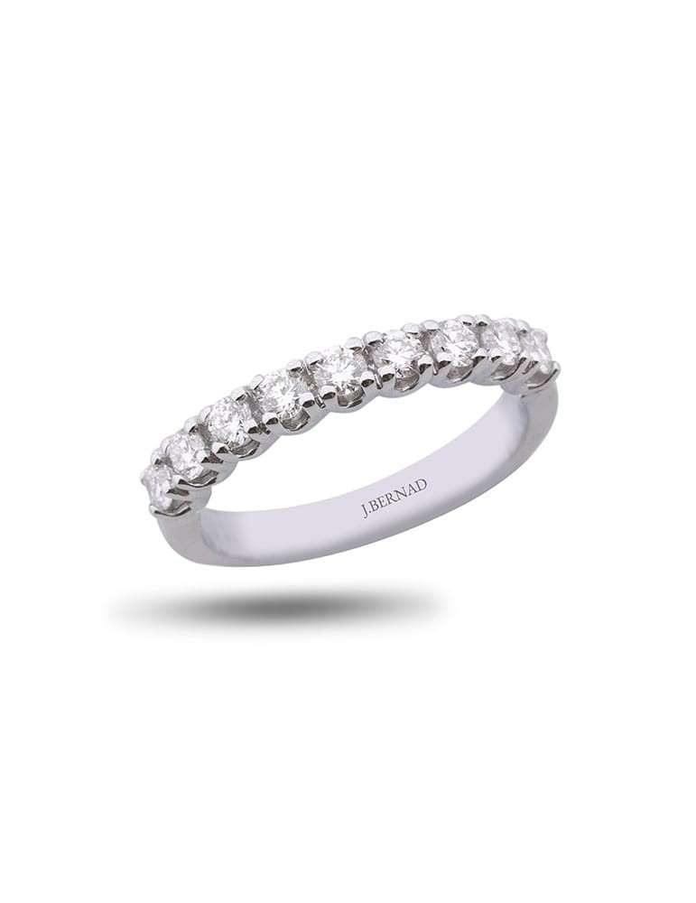 Anillo media alianza de oro blanco 18K con 9 brillantes en garra en U de 0,35 ctes