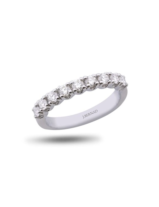 Anillo media alianza de oro blanco 18K con 9 brillantes en garra en U de 0,35 ctes