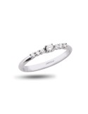 Anillo de oro blanco 18K con brillante central y 6 diamantes laterales de 0,15 ctes